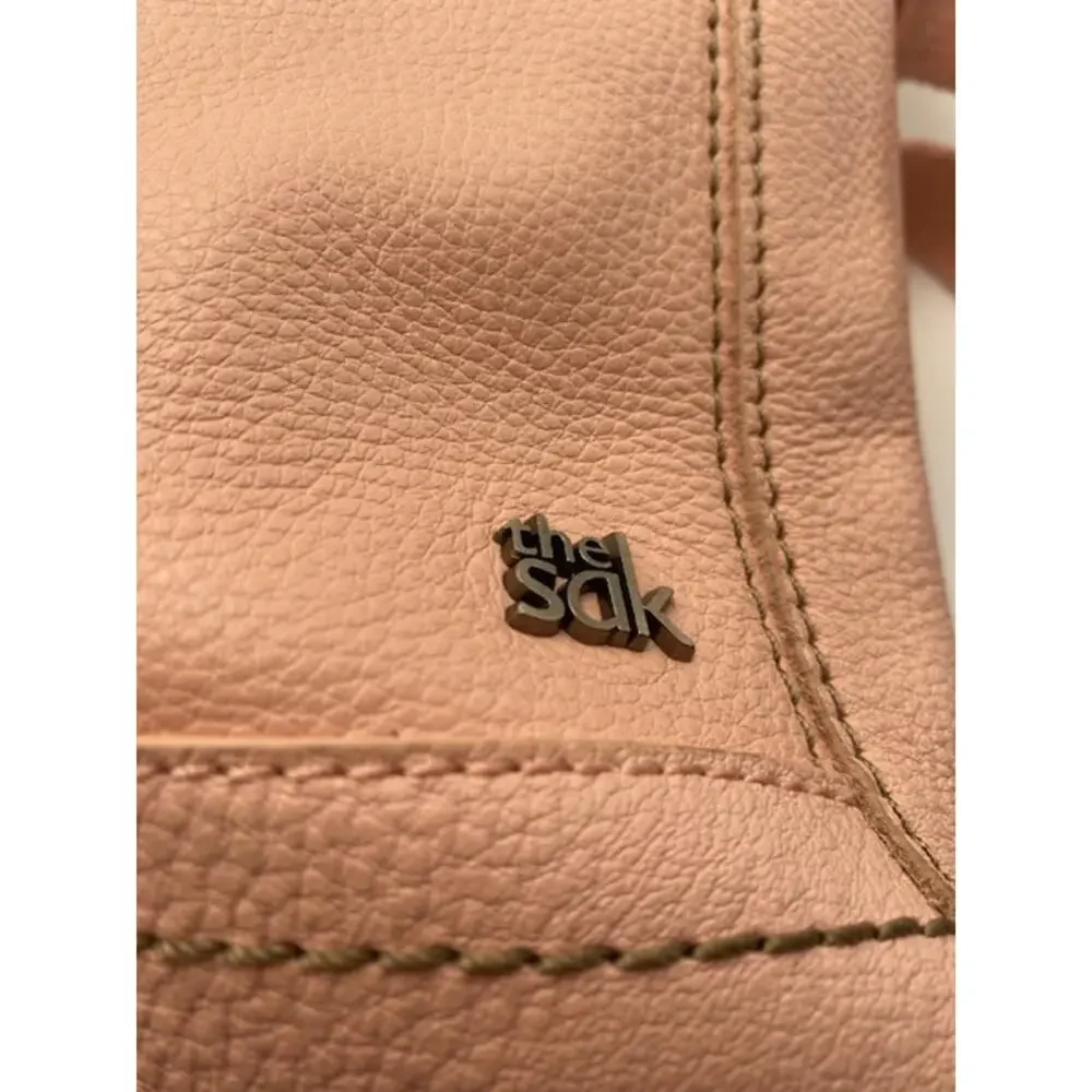 The Sak Pink Pebbled Leather Crossbody Bag Adjustable Strap Multi Pocket Purse